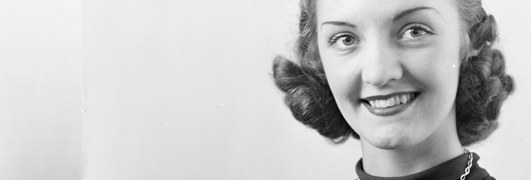 Black and white photo, smiling woman